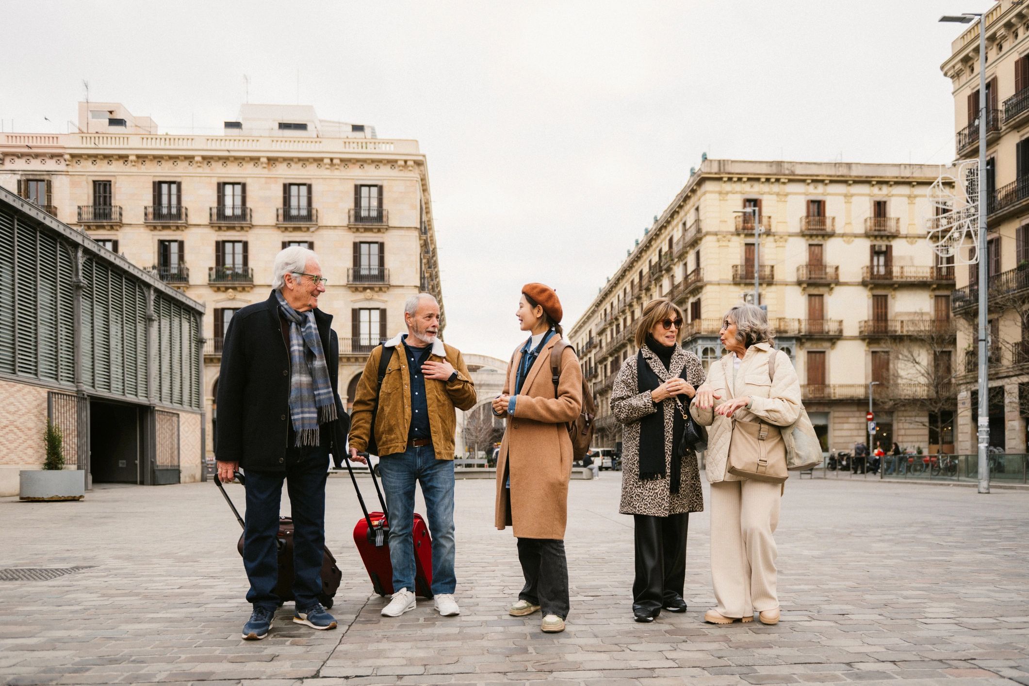 Tour guide showing a city to a group of seniors