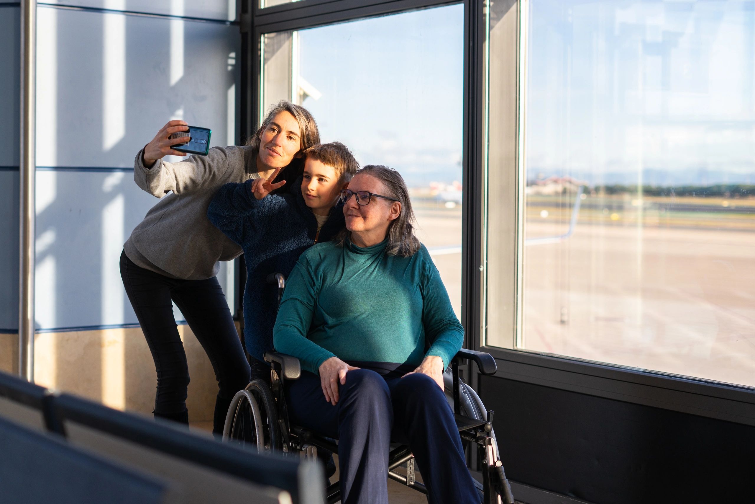 Grandmother at the airport with family before a trip