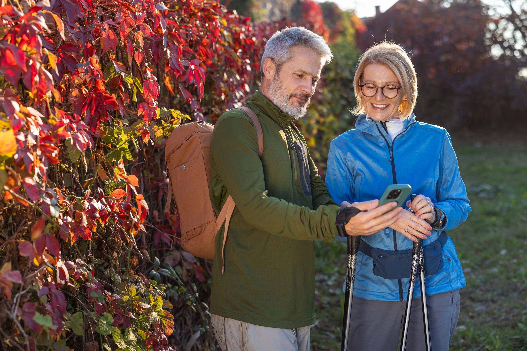 Mature couple reviewing travel plans together outdoors