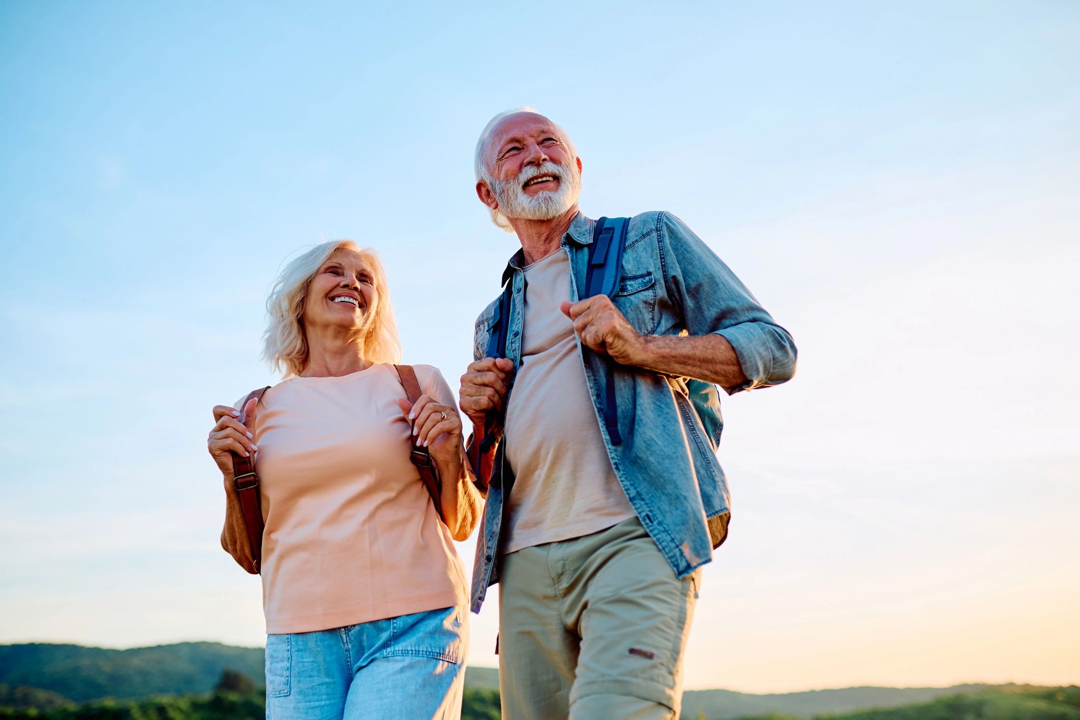 Active senior couple enjoying a well-paced outdoor trip