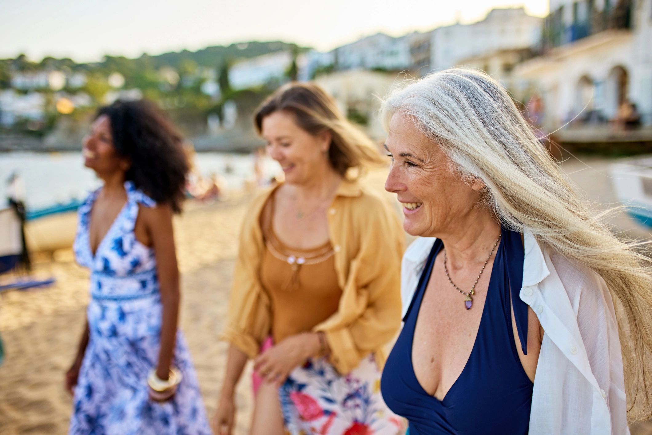 Older adults enjoying travel together by the coast