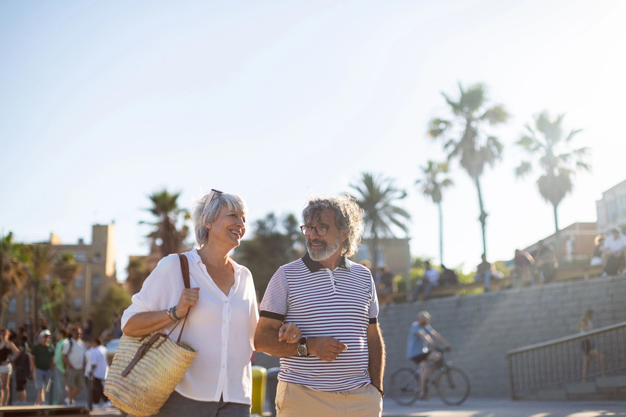 Senior couple enjoying a relaxed destination walk by the water